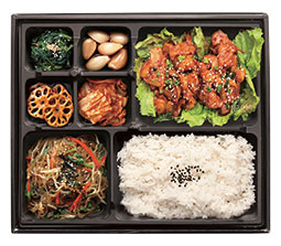 Spicy dakgalbi chicken bento box with rice and kimchi